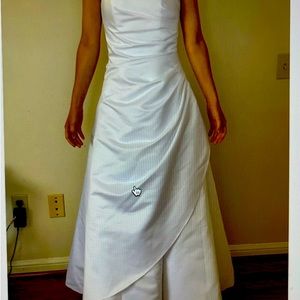 Strapless wedding dress by David’s Bridal size 8. Worn once.  Style: T8076